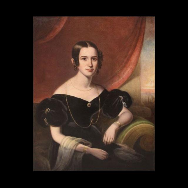 A portrait of Amanda Sims Boswell. She is seated at three-quarter profile against an orange background. She is wearing a dark dress and her hair is pulled back. Her left arm is propped up on her seat, and her right arm lays in her lap. 